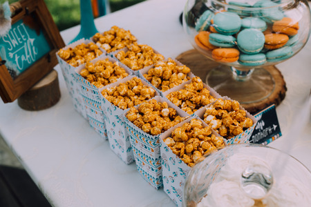 Holiday design for children's holiday in boho style, a magical children's birthday party. Design frame with bird feathers in turquoise, beautiful Indian hut with beautiful cushions and printsの写真素材