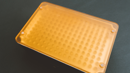 LED constant light for video and photography shooting on a white background. The LED flash is photographed at close rangeの写真素材