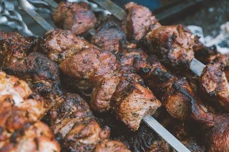 cooking meat on skewers, camping with the cooking meat. Cooking meat on the coalsの写真素材