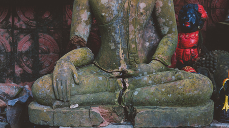 broken statue of Buddha close-upの写真素材