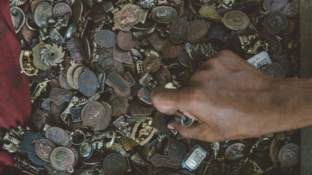 Thai amulets on the market close-up. Religious Buddhist amulets for protection and good luckの写真素材