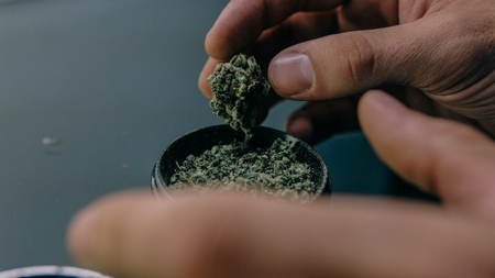 grinder for smoking  marijuana buds. Smoke culture in details close-upの写真素材