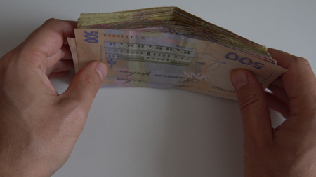 Banknotes of Ukrainian hryvnia on white background  close-up.