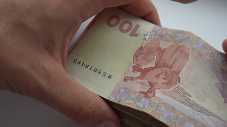 recount money ukrainian hryvnia bills in mans hands close-up.
Finance crisis in Ukraine, the fall of the hryvnia to the dollar exchange rateの写真素材