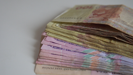 Banknotes of Ukrainian hryvnia on white background  close-up.