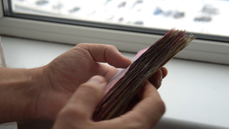 recount money ukrainian hryvnia bills in mans hands close-up.
Finance crisis in Ukraine, the fall of...