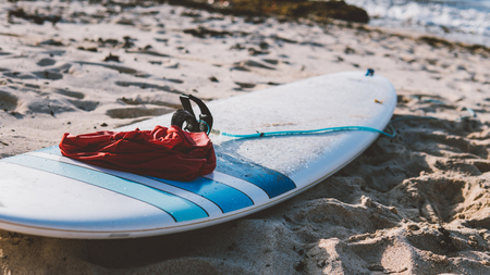 surf board lying on the sand close-up. water extreme sports in the tropicsの写真素材