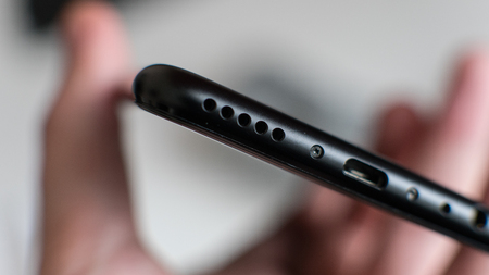 black modern smartphone in mans  hand