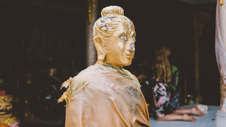 a statue of a golden buddha close-up. Bodhi condition of holy godの写真素材