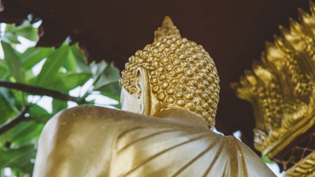 a statue of a golden buddha close-up. Bodhi condition of holy godの写真素材