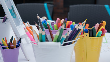 children's drawing school, children's creativity with brushes and felt-tip pens close-up.の写真素材