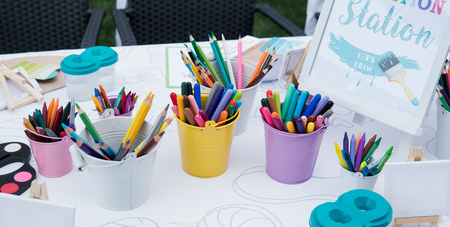 children's drawing school, children's creativity with brushes and felt-tip pens close-up.の写真素材