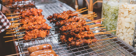 meat kebabs on the Thai market close-up.の写真素材