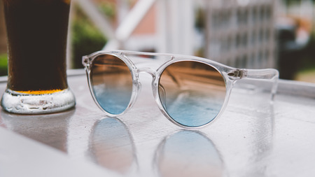 sunglasses on vacation in the tropics close-up. 
concept of relaxation and relaxation in the tropicsの写真素材