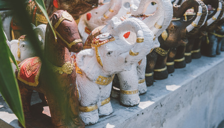 wooden statues of elephants close-upの写真素材