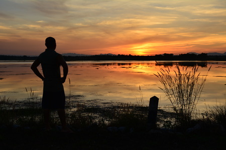 Humans looking for something in the evening.の写真素材