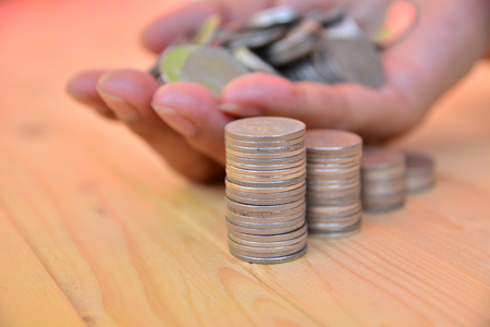 stack coins put on hand for save money and financial, tax season