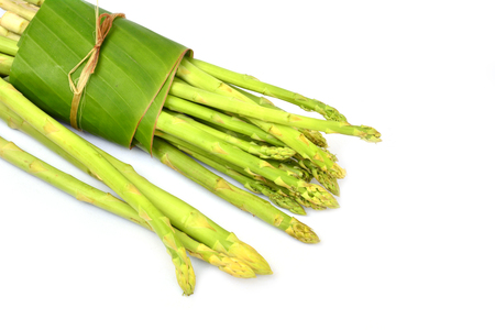 Fresh green asparagus isolated on white backgroundの写真素材
