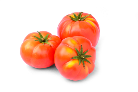 Fresh red tomato isolated on white backgroundの写真素材