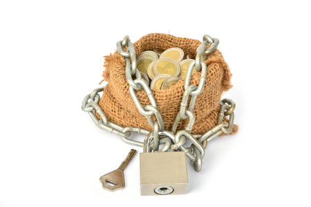 coins with chain with key and sack bag isolated on with white background for business and financial concept.の写真素材