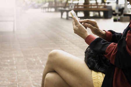 Woman using smartphone, personal chat, and social mediaの写真素材