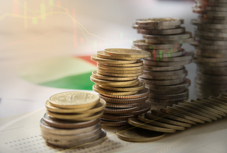 Double exposure stock financial indices with stack coin. Financial stock market in accounting market economy analysis.の写真素材