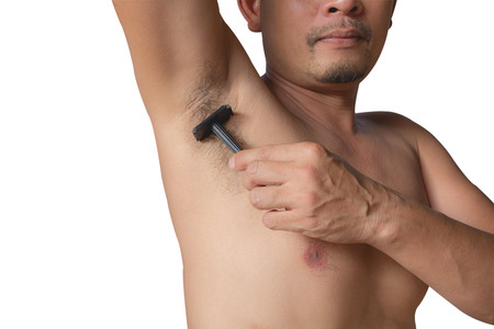 armpits and razor hairy. Shaves a man's armpit with a close-up blade isolated on a white background.の写真素材