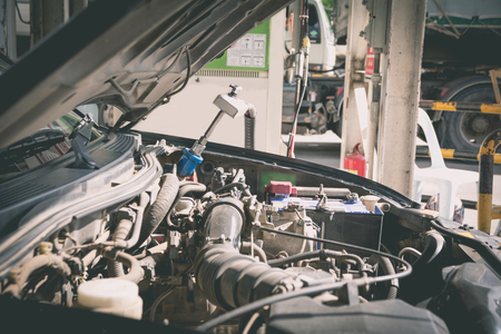 Natural gas vehicle and head dispenser to a car at the gasoline station.の写真素材