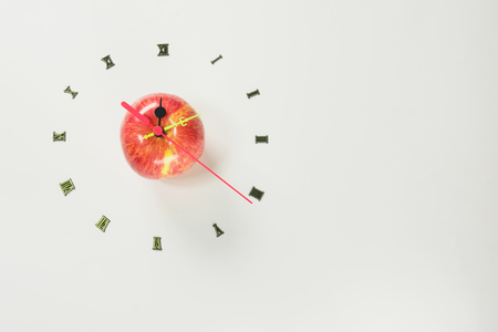 The apple with number of clock, apple shape clock on white background with copy space.の写真素材