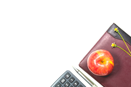 The apple with leather book, pen and calculator isolated on white background with copy space.の写真素材