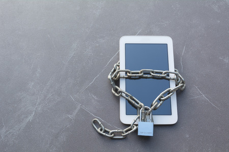Smart phone with chain and lock for safety and security concept.