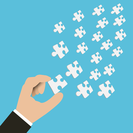 Vector of hand of businessman holding pieces of jigsaw. Hand with jigsaw.のイラスト素材