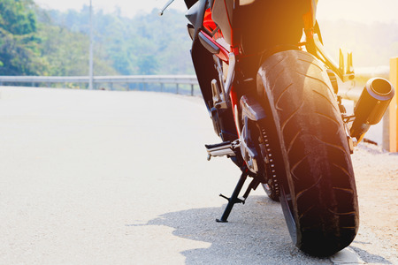 A motorcycle parking on the road right side and copy space for text.の写真素材