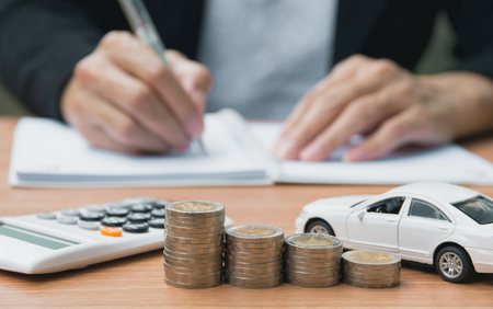 Businessman with car insurance and car services. Car insurance and financial concept.の写真素材