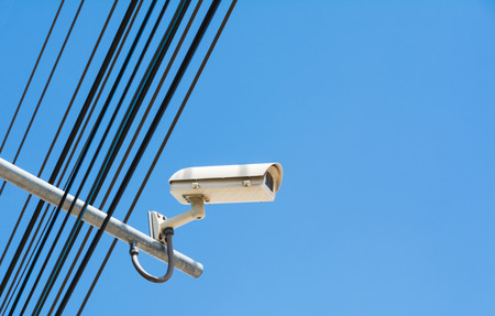 Closed Circuit Television camera with copy space. Closed circuit television recording on sky background.の写真素材