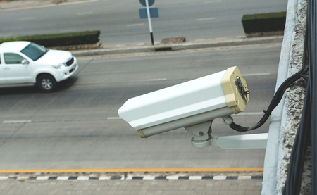 Closed Circuit Television camera. Closed circuit television recording on road background.の写真素材