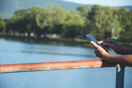 Hand of woman using smartphone, personal chat, and social media.の写真素材