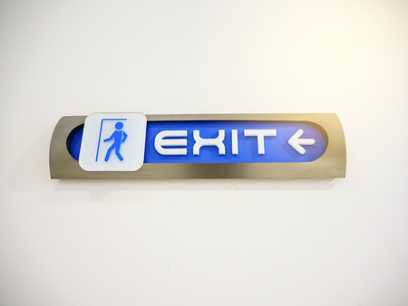 Blue emergency exit sign in the shopping mall.の写真素材