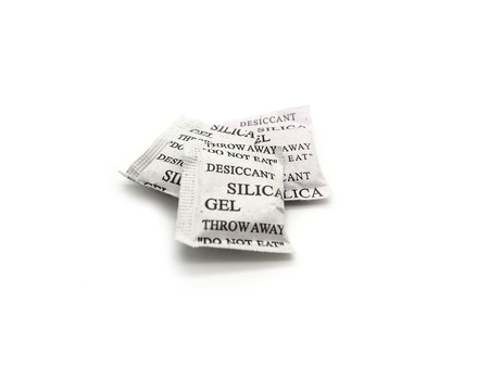 Silica gel packets isolated on a white background.の写真素材