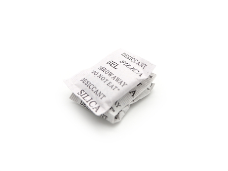Silica gel packets isolated on a white background.の写真素材