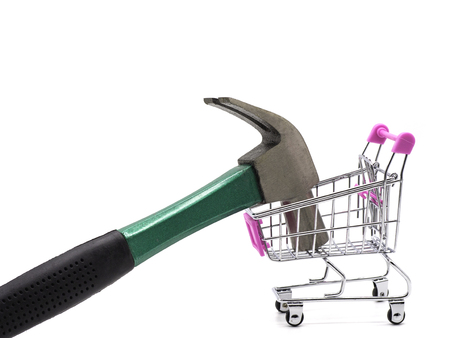 Hammer and shopping cart on white and white background.の写真素材
