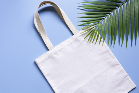 White tote bag canvas fabric. Cloth shopping sack mockup with copy space.の写真素材