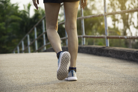 A woman running at the morning for jogging, exercising and healthy lifestyle concept.の写真素材