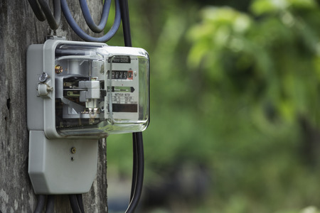 Electric power meter measuring power usage. Watt hour electric meter measurement tool with copy space.の写真素材