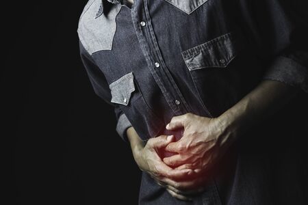 Male suffering from stomachache pain. A man stomachache for healthy concept.の写真素材