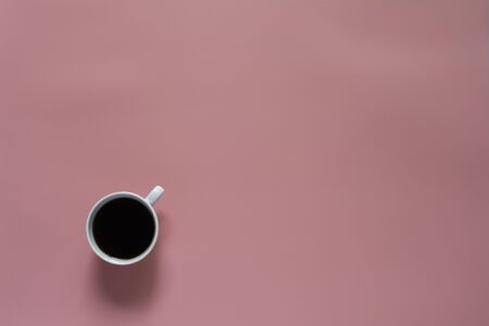 Top view of coffee on pink background and copy space for insert text.の写真素材