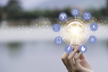 Innovation and energy concept of hand hold a light bulb and copy space for insert text.