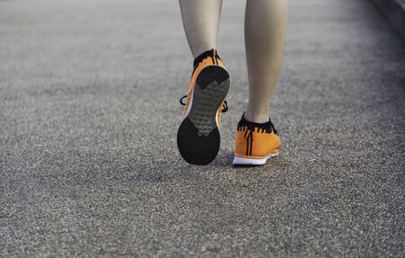 A woman running at the morning for jogging, exercising and healthy lifestyle concept.