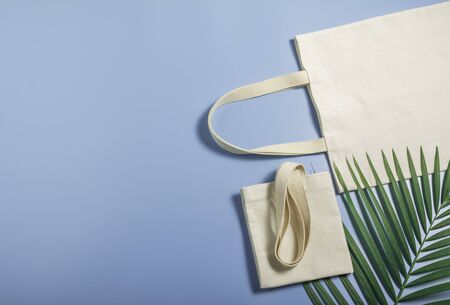 White tote bag canvas fabric. Cloth shopping sack mockup with copy space.の写真素材