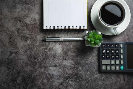 Concrete table with coffee with office accessories.Top view of Coffee cup on concrete background with copy space.の写真素材